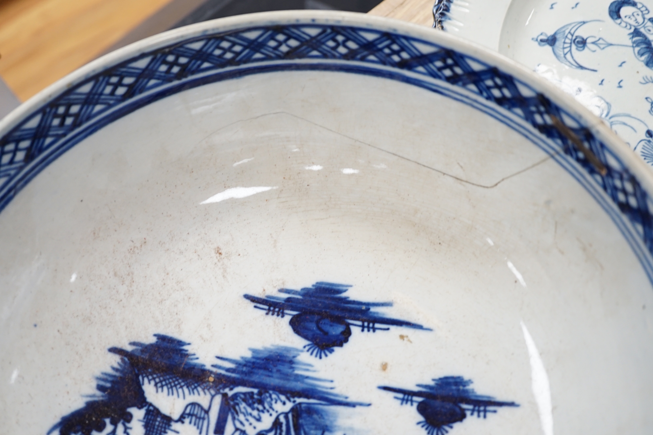 A collection of late 18th/early 19th century pearlware and creamware including three black transfer printed creamware plates, c.1780, blue and white bowls, plates, dishes and jug, the largest 27cm in diameter